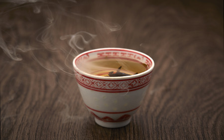Traditional tea ceremony, teacup with wooden backgroundの写真素材