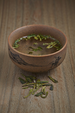 Traditional tea ceremony accessories, teacup with wooden backgroundの写真素材