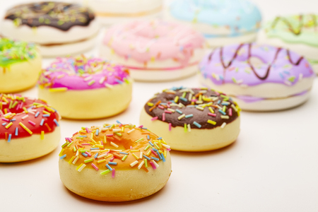 Colorful doughnut on white background tableの写真素材