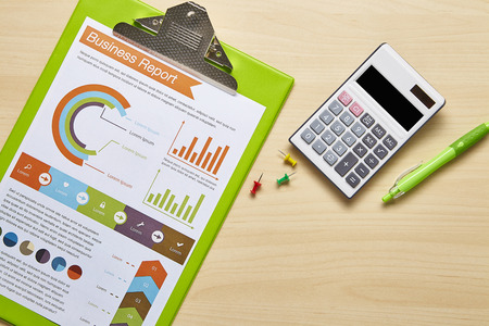 Modern office desk table with green stationeryの写真素材