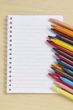 Colorful crayon on wooden tableの写真素材