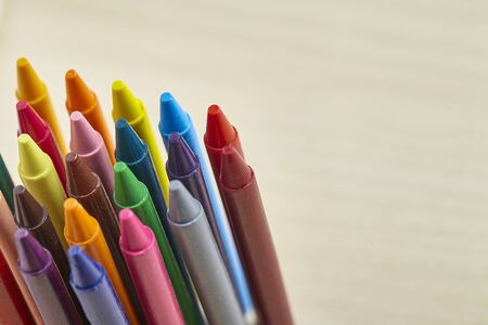 Colorful crayon on wooden table