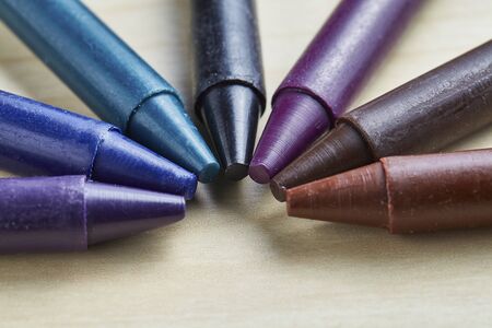Colorful crayon on wooden table