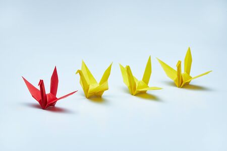 Red origami crane leading group, shallow depth of fieldの写真素材