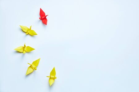 Red origami crane leading group, shallow depth of fieldの写真素材