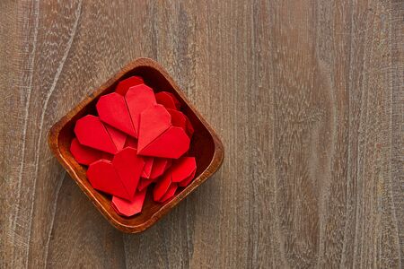 Valentines day red heart on wooder table background, top view with copy spaceの写真素材