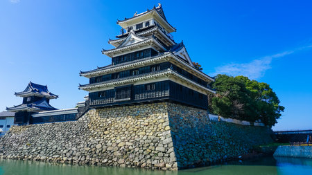Nakatsu Castle Castle Tower in Nakatsu Castle Park reflecting in the blue skyのeditorial素材