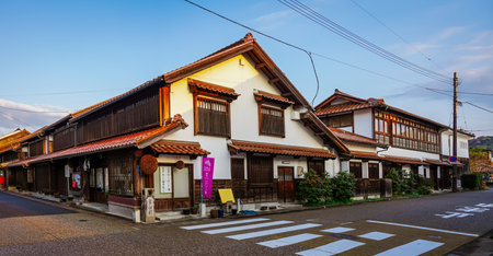 Early in the morning on a sunny day, the cityscape of the Kurayoshi White Wall Storehouses...