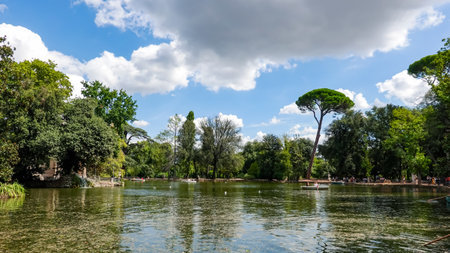 Boating in the picturesque landscape, Rome's Borghese Park and the 'Lake Garden' where the Temple of Asklepios is builtの写真素材