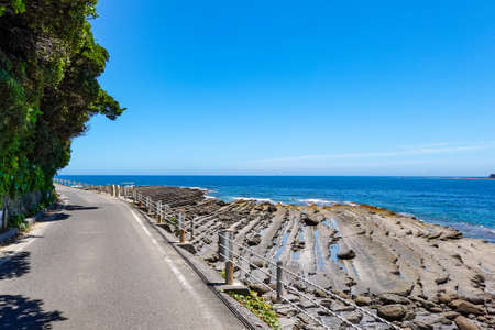 A strange rock by the sea near Udo Jingu Shrine built on a cliff facing Hyuga Nada (Ninan City, Miyazaki Prefecture)の写真素材