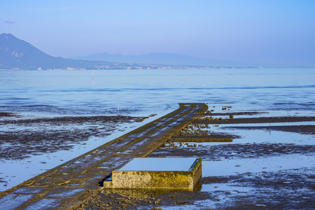 Morning of the tidal flats Mikorai coast of the Ariake Sea (Amida Coast Park, Udo City, Kumamoto Prefecture)の写真素材