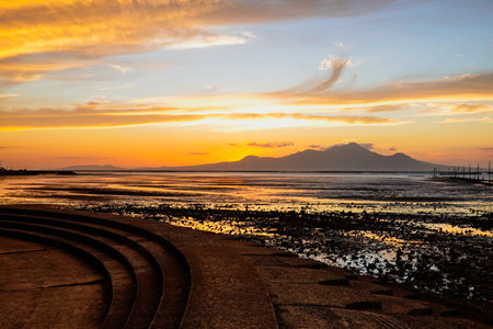 Sunset tidal flats Nagabuta Kaitoko Road (Uto City, Kumamoto Prefecture)の写真素材