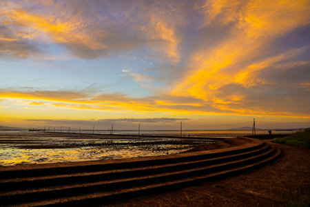 Sunset tidal flats Nagabuta Kaitoko Road (Uto City, Kumamoto Prefecture)の写真素材