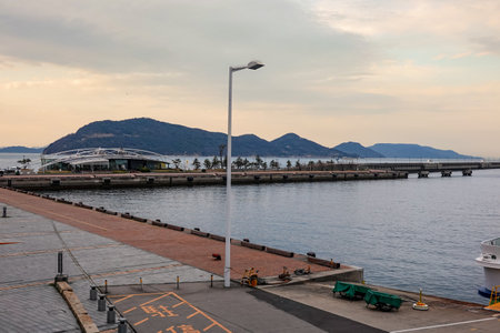 Spring evening: Ships arriving and departing from Takamatsu Port from the Takamatsu Corridor (Takamatsu City, Kagawa Prefecture)の写真素材