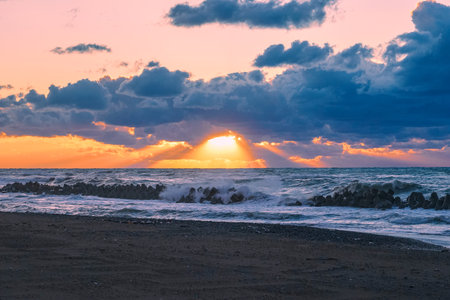 Sunset on the Sea of Japan, rough waves on Mikawa Coast (Hakusan City, Ishikawa Prefecture)の写真素材