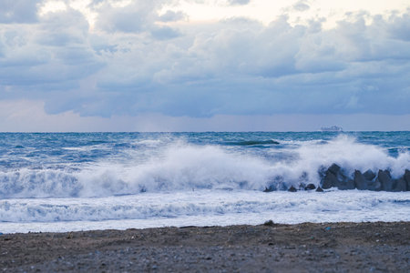 Sunset on the Sea of Japan, rough waves on Mikawa Coast (Hakusan City, Ishikawa Prefecture)の写真素材