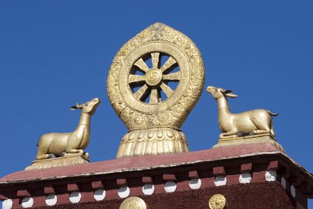 The deer and eternal wheel on the roof of Jokhang Monastry in Lhasa.の写真素材