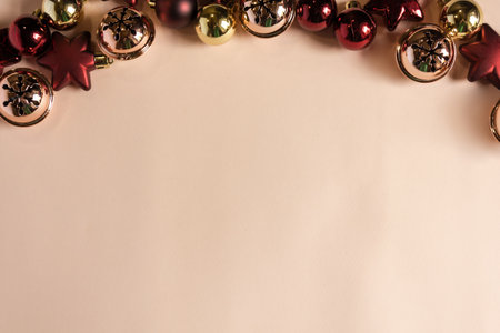 Christmas background with golden and red baubles on a white backgroundの写真素材