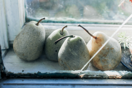 Four rie pears in the kitchen windowの写真素材