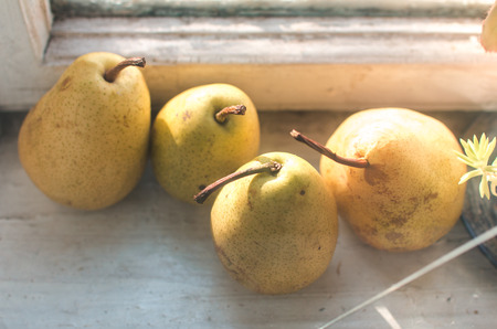 Four rie pears in the kitchen windowの写真素材