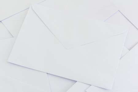 pile of white envelops  on desk