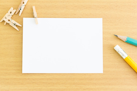 blank note paper with wood clip and pencilの写真素材