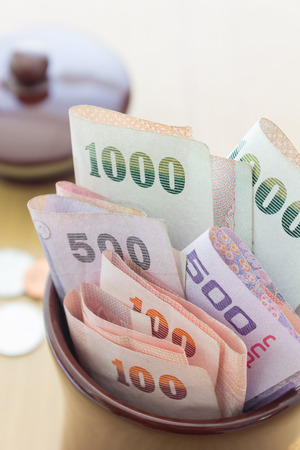A lot of thai money in jarの写真素材