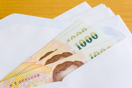 Thai money in white envelope