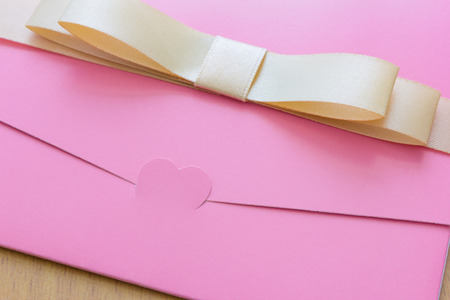 pink wedding card. Focus on Heart shape.の写真素材