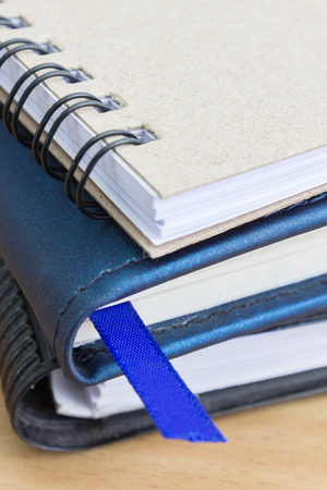 blue bookmarks with three notebooksの写真素材