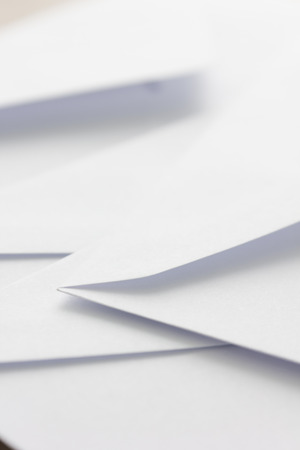 pile of white envelope on tableの写真素材
