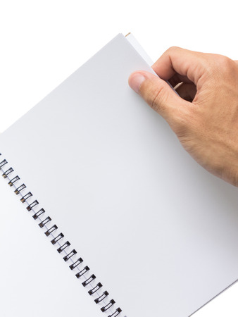 Hand opening book on white backgroundの写真素材