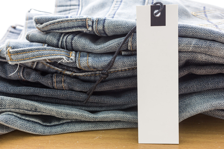 white paper tag with jeansの写真素材