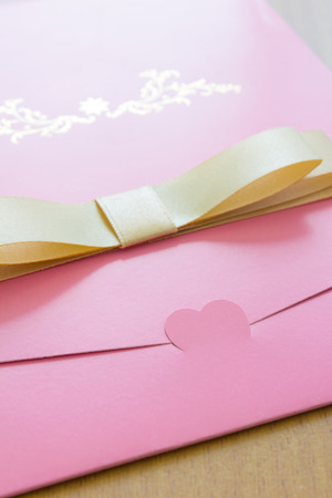 pink wedding card. Focus on Heart shape.の写真素材