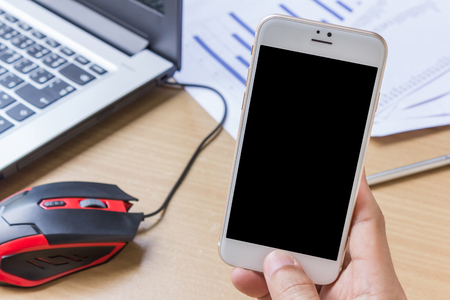 Man hand is using smartphone on deskのeditorial素材