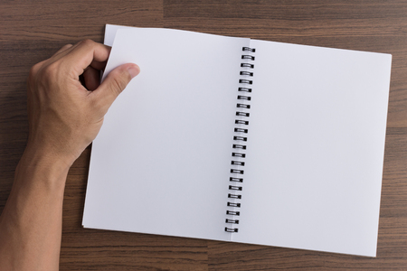 left hand is open a blank book  in top viewのeditorial素材