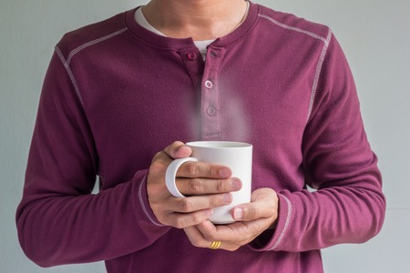 cup of coffee in man hand