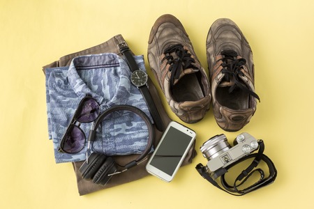 travel accessories in top view on yellow backgroundの写真素材