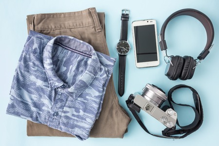 travel accessories in top view on blue backgroundの写真素材