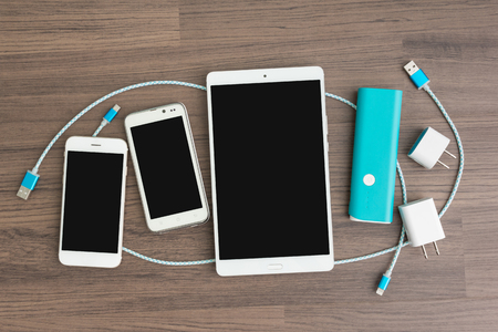 USB charging cables for smartphone and tablet in top viewの写真素材