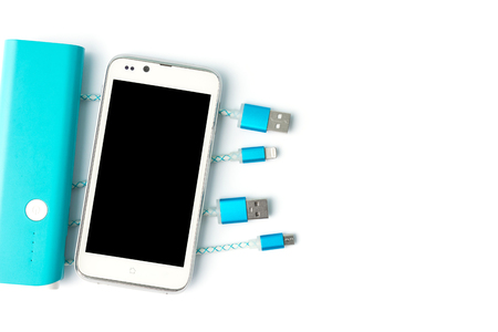 USB charging cables with smartphone and battery bank in top viewの写真素材