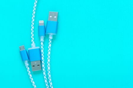 charging cable for smartphone on blue background