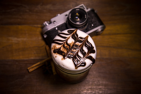 coffee and old retro camera on backgroundの写真素材
