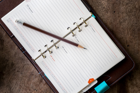 Diary on a wooden table0の写真素材