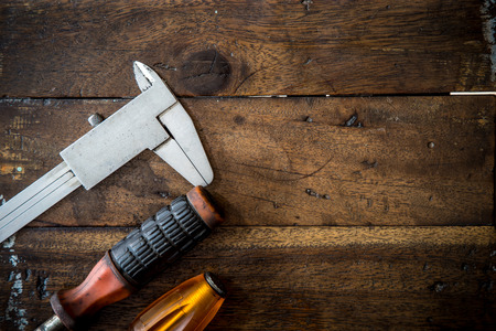 Old tool renovation on wood tableの写真素材
