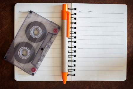 blank notebook with music and cassette.