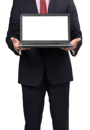 man in suit with laptop standing on white backgroundの写真素材