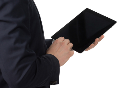 man in suit standing with a tabletの写真素材