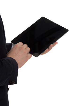 man in suit standing with a tabletの写真素材