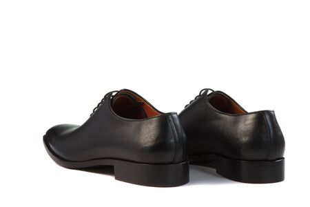 men's shoes on a white background with a shadowの写真素材